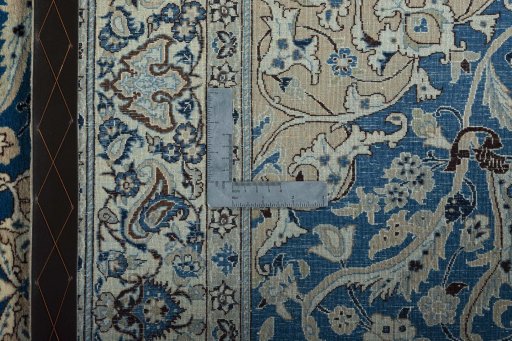 Backside of handmade 1950s Nain rug showing knot structure and weave density