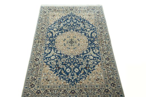 Surface texture of 1950s Nain rug with natural Cork and intricate pattern