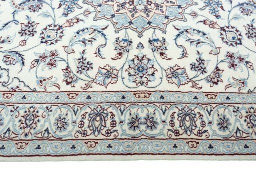 Corner detail of New Nain rug showing border pattern and Wool pile