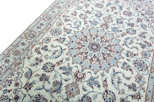 Backside of handmade New Nain rug showing knot structure and weave density