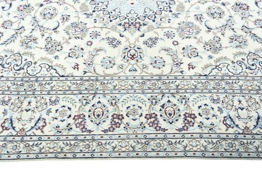 Corner detail of 2000s Nain rug showing border pattern and Wool pile