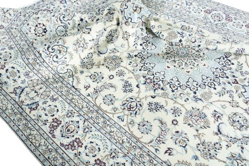 Surface texture of 2000s Nain rug with natural Wool and intricate pattern