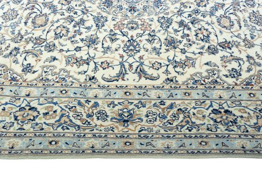 Corner detail of 2000s Nain rug showing border pattern and Wool pile