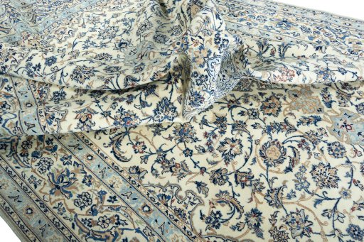 Surface texture of 2000s Nain rug with natural Wool and intricate pattern