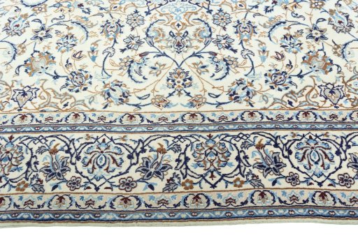 Corner detail of 2000s Nain rug showing border pattern and Wool pile