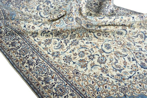 Surface texture of 2000s Nain rug with natural Wool and intricate pattern