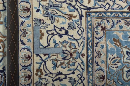 Backside of handmade 2000s Nain rug showing knot structure and weave density