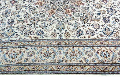 Corner detail of 2000s Nain rug showing border pattern and Wool pile