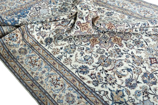 Surface texture of 2000s Nain rug with natural Wool and intricate pattern