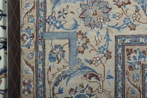 Backside of handmade 2000s Nain rug showing knot structure and weave density