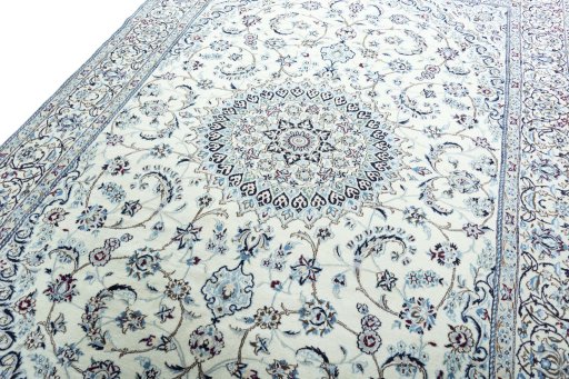 Backside of handmade New Nain rug showing knot structure and weave density