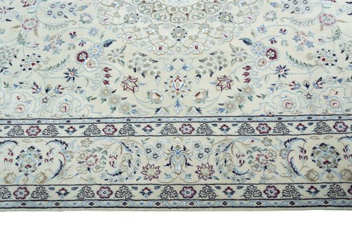 Corner detail of New Nain rug showing border pattern and Wool pile