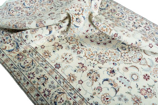 Surface texture of 2000s Nain rug with natural Wool and intricate pattern
