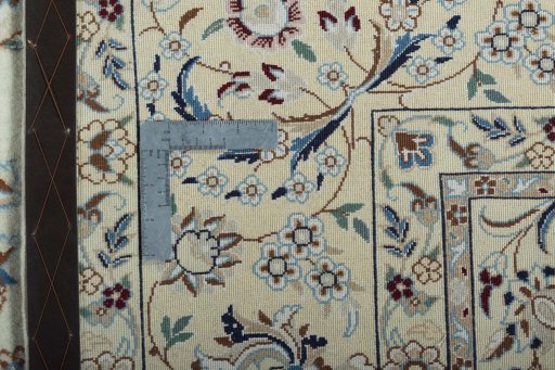 Backside of handmade 2000s Nain rug showing knot structure and weave density