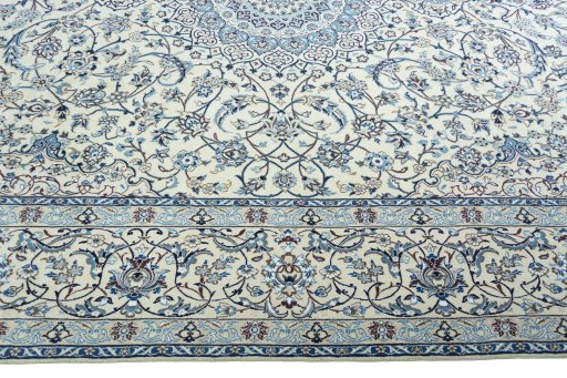 Corner detail of 2000s Nain rug showing border pattern and Wool pile