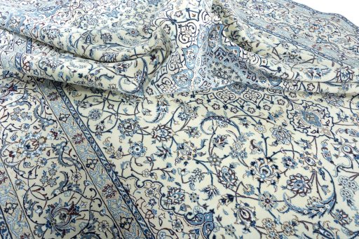 Surface texture of 2000s Nain rug with natural Wool and intricate pattern