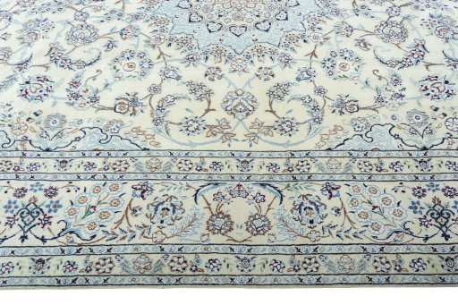 Corner detail of 2000s Nain rug showing border pattern and Wool pile