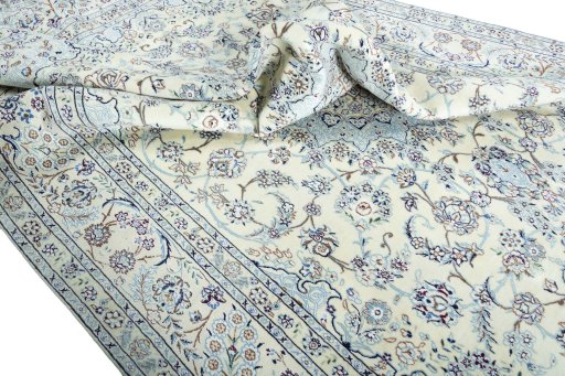 Surface texture of 2000s Nain rug with natural Wool and intricate pattern