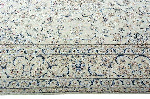 Corner detail of 2000s Nain rug showing border pattern and Wool pile