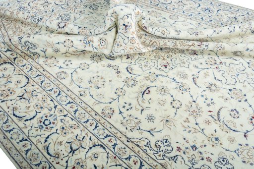 Surface texture of 2000s Nain rug with natural Wool and intricate pattern