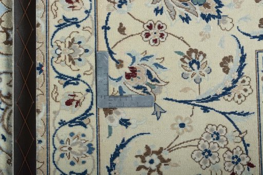 Backside of handmade 2000s Nain rug showing knot structure and weave density