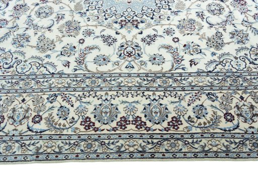 Corner detail of 2000s Nain rug showing border pattern and Wool pile