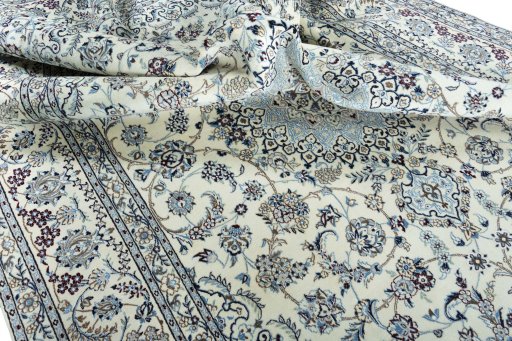 Surface texture of 2000s Nain rug with natural Wool and intricate pattern