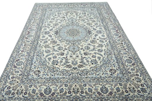 Surface texture of 2000s Nain rug with natural Wool and intricate pattern