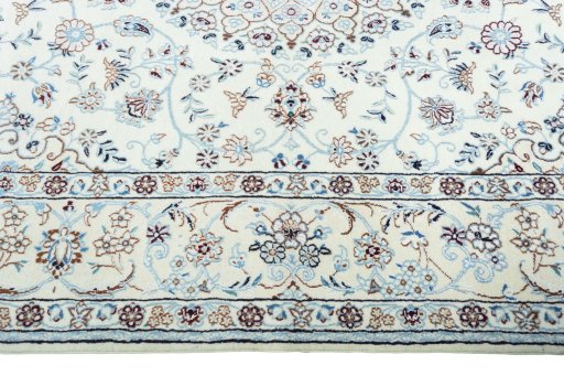 Corner detail of 2000s Nain rug showing border pattern and Wool pile
