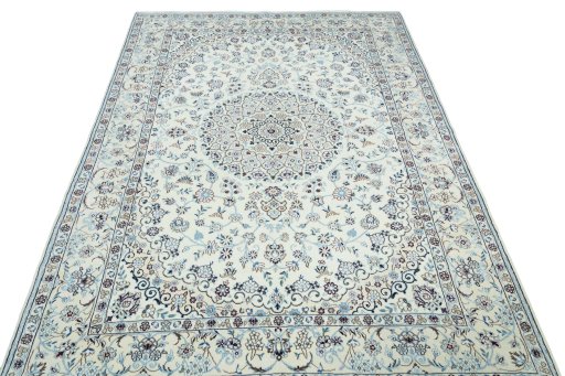 Surface texture of 2000s Nain rug with natural Wool and intricate pattern
