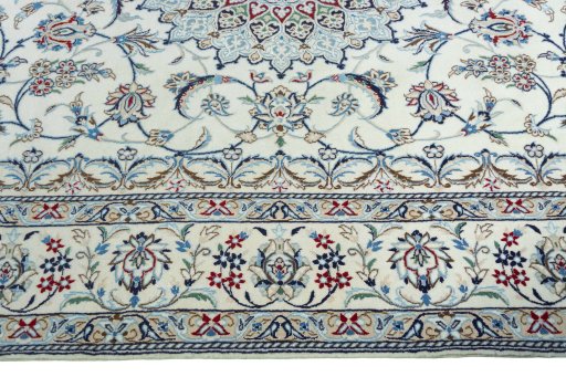 Corner detail of 2000s Nain rug showing border pattern and Wool pile