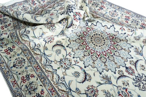 Surface texture of 2000s Nain rug with natural Wool and intricate pattern