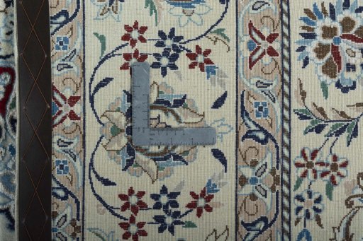 Backside of handmade 2000s Nain rug showing knot structure and weave density