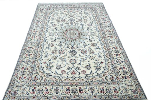 Surface texture of 2000s Nain rug with natural Wool and intricate pattern