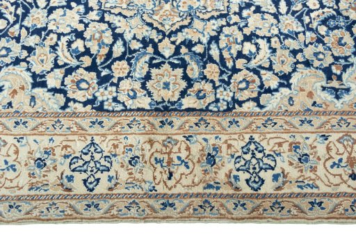 Corner detail of 2000s Nain rug showing border pattern and Wool pile