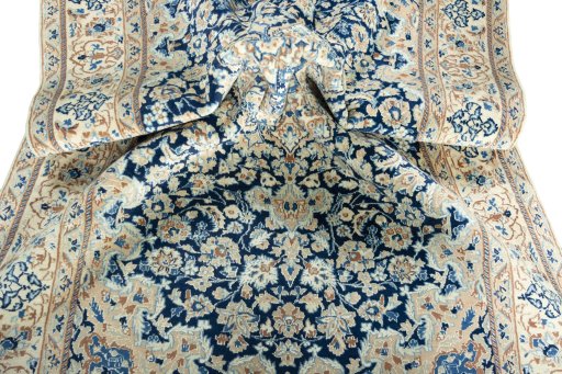Surface texture of 2000s Nain rug with natural Wool and intricate pattern