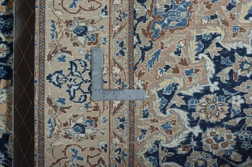 Backside of handmade 2000s Nain rug showing knot structure and weave density