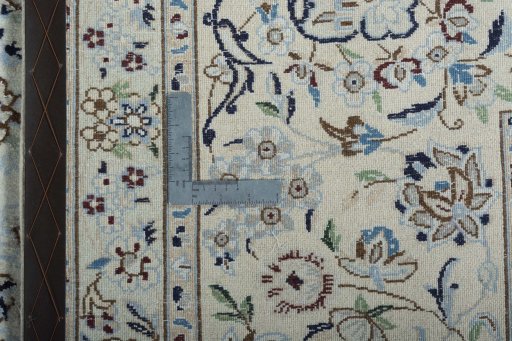 Backside of handmade New Nain rug showing knot structure and weave density