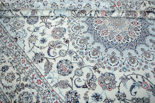 Backside of handmade New Nain rug showing knot structure and weave density