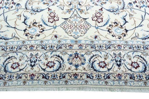 Corner detail of New Nain rug showing border pattern and Wool pile