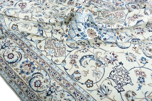 Backside of handmade New Nain rug showing knot structure and weave density