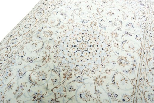 Backside of handmade New Nain rug showing knot structure and weave density
