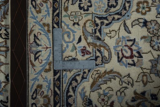 Backside of handmade New Nain rug showing knot structure and weave density