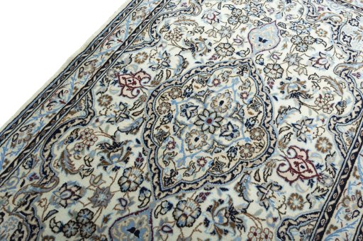Backside of handmade New Nain rug showing knot structure and weave density