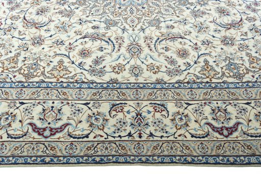 Corner detail of 2000s Nain rug showing border pattern and Wool pile