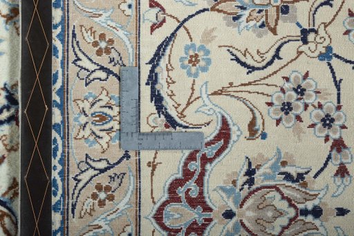Backside of handmade 2000s Nain rug showing knot structure and weave density