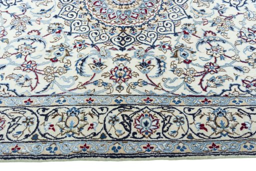 Corner detail of New Nain rug showing border pattern and Wool pile