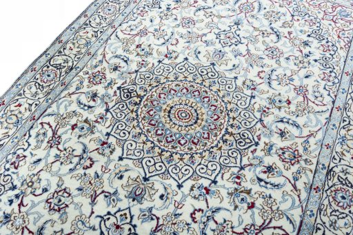 Backside of handmade New Nain rug showing knot structure and weave density