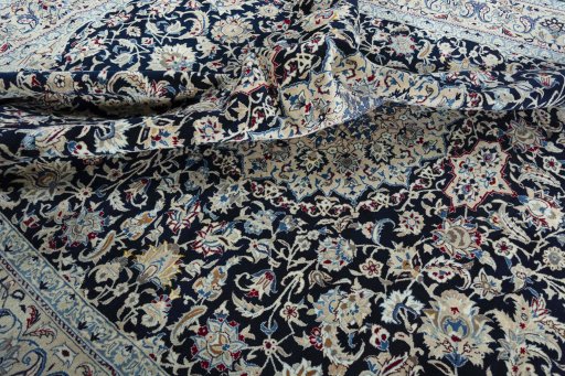 Surface texture of 2000s Nain rug with natural Wool and intricate pattern