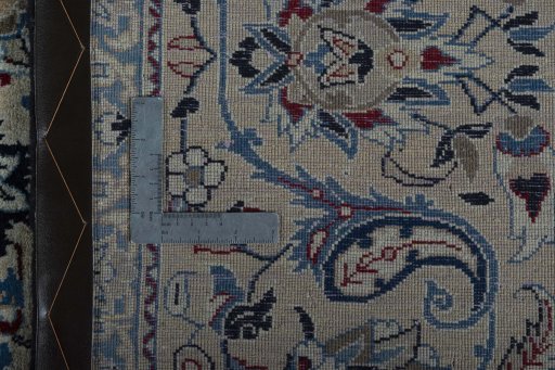Backside of handmade 2000s Nain rug showing knot structure and weave density